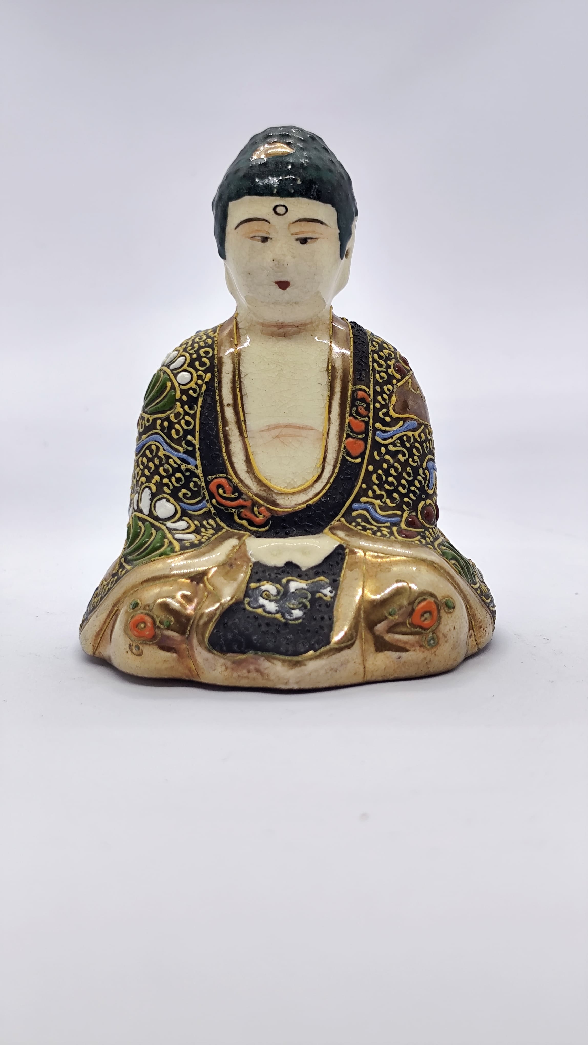 Buda de faiança.
